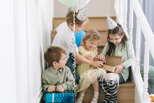 children opening gifts